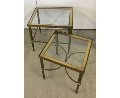 A pair of brass framed, glass top coffee side tables. One 46 x 41 x 42cm, the other 36 x 36 x 37cm. Smaller table has chip to