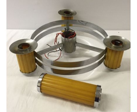 A retro chrome and amber plastic hanging light fixture.