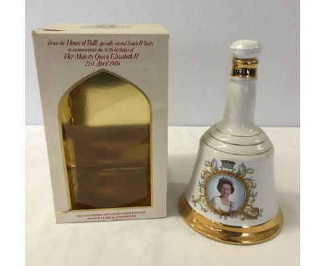 A boxed Bells whisky decanter sealed with contents (750ml) commemorating the Queens 60th birthday.