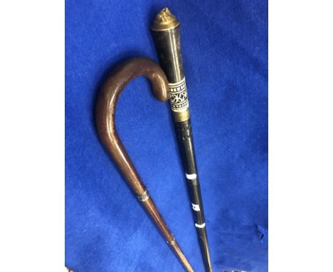 An Indian sword stick plus another walking stick