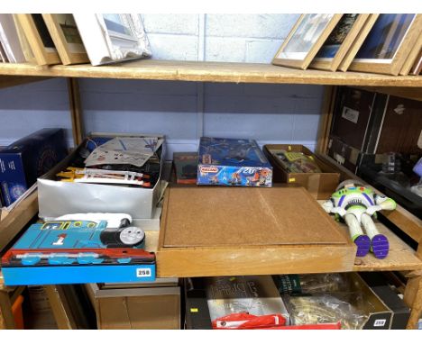 Shelf of vintage Children's toys and games including Meccano, Lego and Scalextric