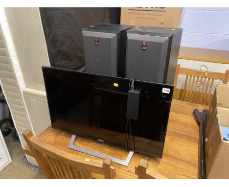 A Sony Bravia 32" flat screen television and a pair of Vision speakers