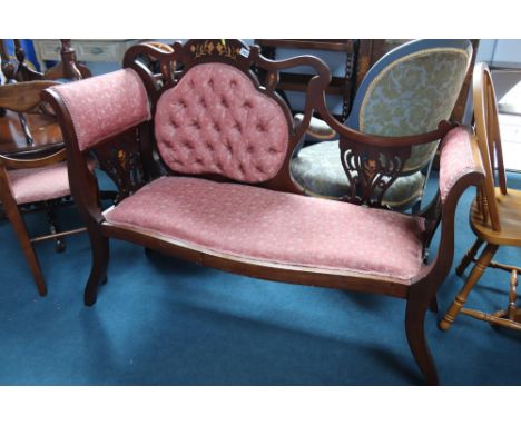 An Edwardian marquetry inlaid settee
