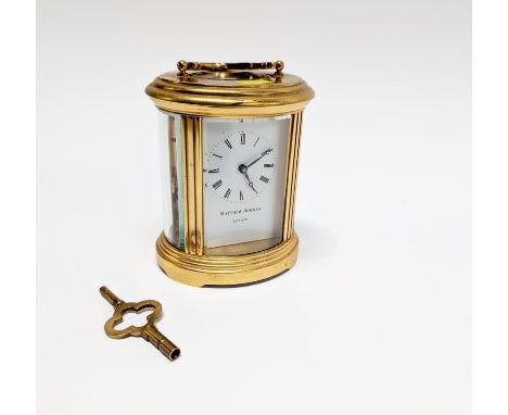 A Matthew Norman of London brass cased carriage clock, with key