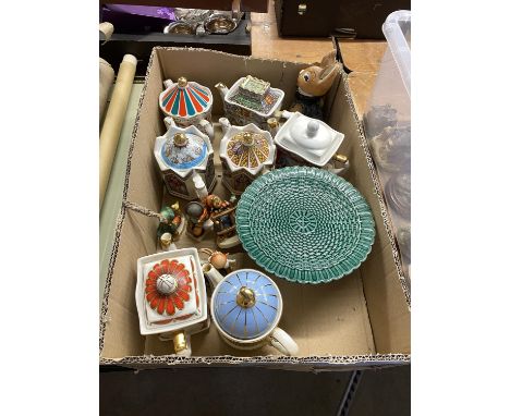 A box of Sadler and other commemorative teapots, glazed green tazza and Hummel figures