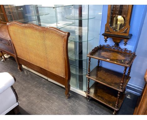 A beige double headboard and a walnut Victorian what not