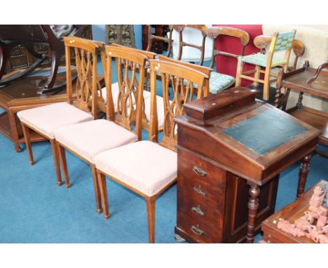 An Edwardian Davenport and six Edwardian chairs