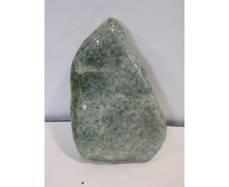 A large polished green stone crystal boulder. L.31cm 