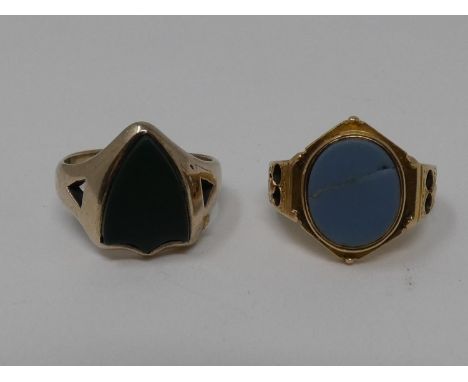 Two stone set signet rings. One yellow metal with an oval agate cartouche, engraved and pierced floral details to the shoulde