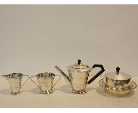 An Art Deco silver plated four piece coffee set comprising coffee pot, cream jug, sugar bowl and lidded butter dish, marked E