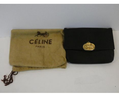 A black silk Celine clutch bag retailed by Fior of Knightsbridge, with original dust bag. H.14,5xW.19cm 