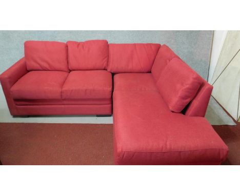 A contemporary L-shaped sofa in rose upholstery. H.71 W.190 (long end) W.134 (short end) D.80cm 