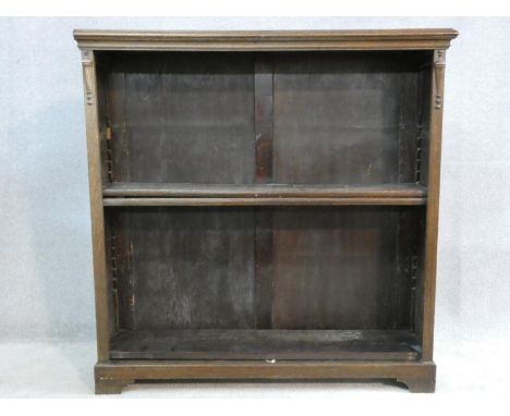 A mid century vintage oak open bookcase on bracket feet. H.107 W.106 D.29cm 