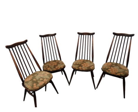 A set of four Ercol dining chairs - shaped rail backs and stick splats on contoured seats and turned legs. 