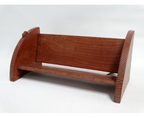 A 20th century adzed oak book trough - by Robert 'Mouseman' Thompson of Kilburn, with semi circular solid ends and mouse carv