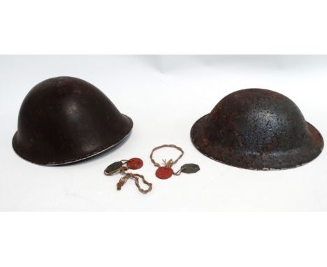 A British Army Mark III 'Turtle' combat helmet - including interior webbing, together with two pairs of dog tags, an earlier 