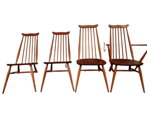 A set of four Ercol dining chairs - including one with arms, with shaped rail back and stick splats above a solid contoured s