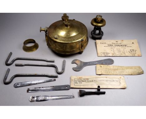 An early 20th century Primus stove - complete with original lithographed tin box, including instructions and cleaning tools.