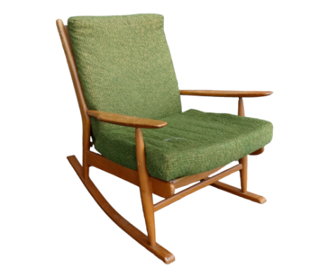 A 20th century Ercol beech framed rocking chair - with green upholstered loose cushions.