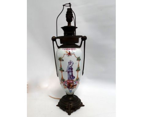 A continental ceramic and brass mounted lamp - now converted to electricity, decorated with a classical figures, height 55cm.