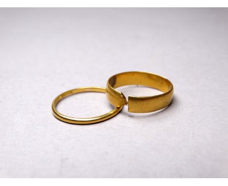 A fine 22ct yellow gold wedding band, size O - together with another cut 22ct yellow gold wedding band, size L, total weight 