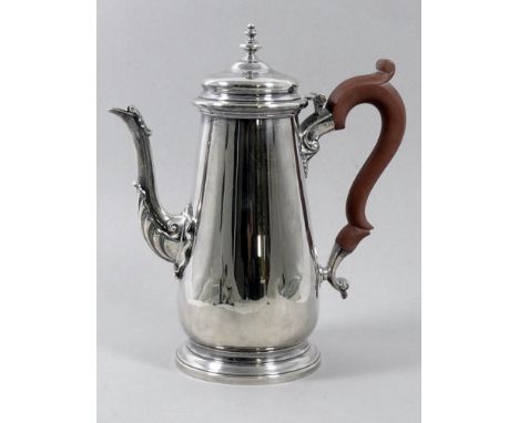 A George III style silver coffee pot - London 1979, Garrard &amp; Co., of plain tapering form with a leaf moulded spout, rais