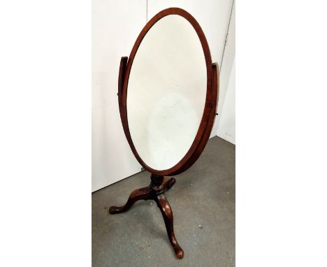 An unusual mahogany oval cheval mirror - the U-shaped support on a tripod base with cabriole legs and pointed pad feet, width