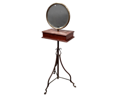 An Edwardian walnut and brass height adjustable shaving stand - the circular bevelled mirror above a twin hinged box on a bra