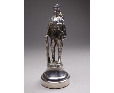 A cast silver figure of the Brigade of Gurkhas - London 1924, Goldsmiths &amp; Silversmith Co. Ltd., standing at ease with ri