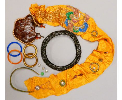 A quantity of late 19th/early 20th century jewellery - including a paste collar, a beaded hair net, a yellow silk embroidered