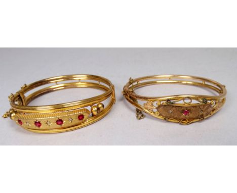 A gilt metal bangle - set with garnet and diamonds, together with another similar, total weight 27.4g.