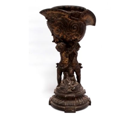 A late 19th century cast metal and gilt oil lamp base - in the form of cherubs supporting a morion, height 38cm. 