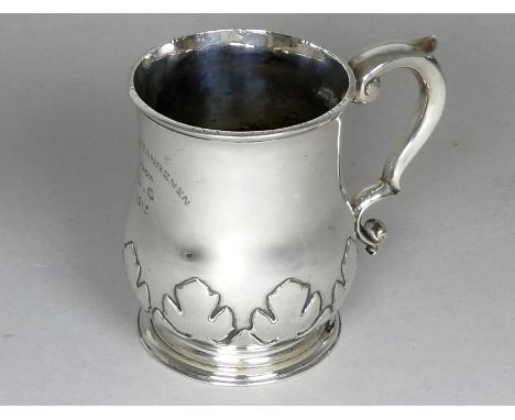 A silver half pint baluster shaped christening mug - London 1913, Silversmiths &amp; Goldsmiths Co. Ltd, with presentation in