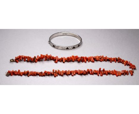 A stick coral necklace - length 44cm, together with a silver bangle set with hardstone.