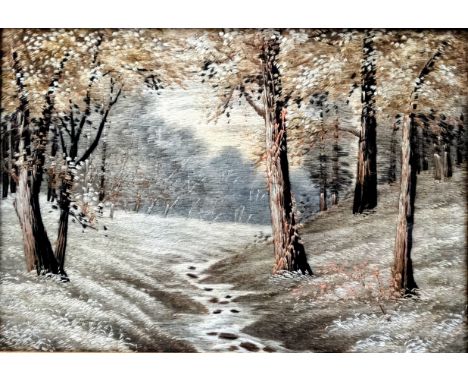 A late 19th/early 20th century silk embroidered panel, depicting a stream through a woodland, 21cm x 30cm