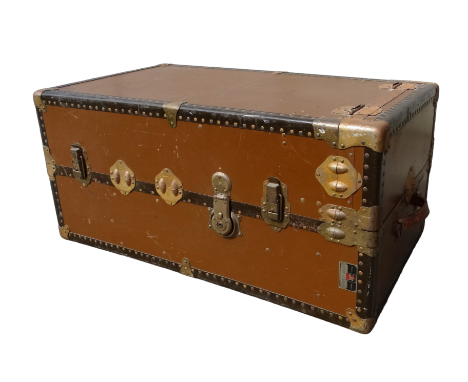 A Victor Luggage travelling trunk - with metal corners and mounts and leather carrying handles, the interior fitted with hang