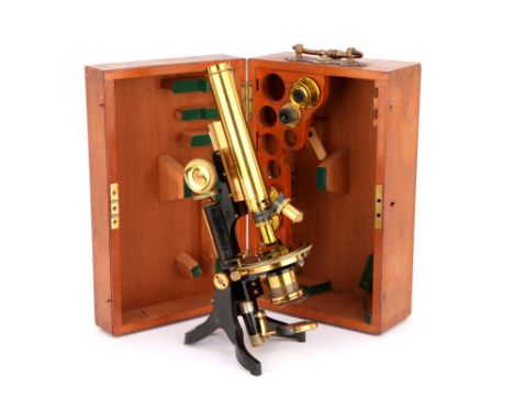 A Swift Student Petrological Microscope, c.1900, English, signed to foot Swift &amp; Son, London, supported on a black enamel