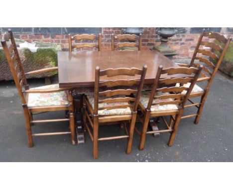 Oak pull out dining table together with set of six wavy ladder back chairs. Condition report: see terms and conditions