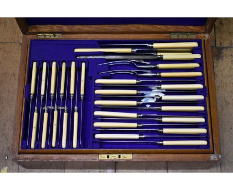 An oak canteen of Old English plated cutlery for twelve, by W H &amp; S C H,&nbsp;having bone handled knives. 