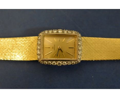 A vintage 18ct gold and diamond Omega ladies manual wind cocktail watch, cal 484, movement number 27747065 (1968), on mesh br