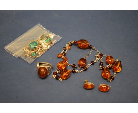 A silver suite of synthetic opal jewellery; together with a collection of silver and amber style jewellery. 