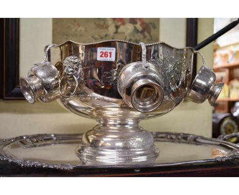 A Sheffield plate punch bowl,&nbsp;including six matching cups and associated ladle. 