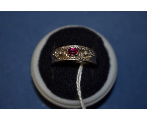 An 18ct white gold ruby and diamond ring. 