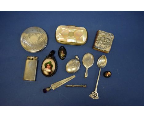 An Arabic white metal powder compact;&nbsp;together with a mother of pearl covered coin purse; and other items. 