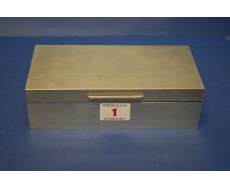 A silver rectangular engine turned cigarette box, by C J Vander,&nbsp;London 1963, 18cm x 9cm, 540g all in. 