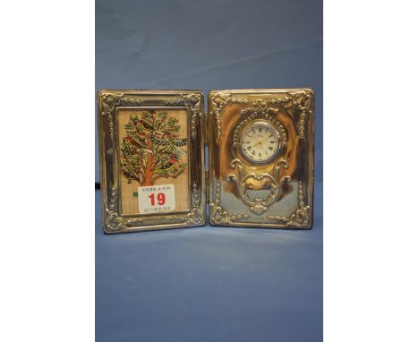 A silver double photograph and clock frame, by  Carr's of Sheffield Ltd, Sheffield 1996, 12cm x 18.5cm. 