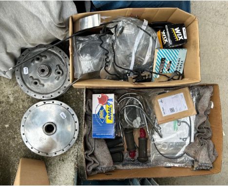 Assorted spares, including two wheel hubs, various new gaskets, Norton fork seal kit, re-conditioned Velocette magneto, vario