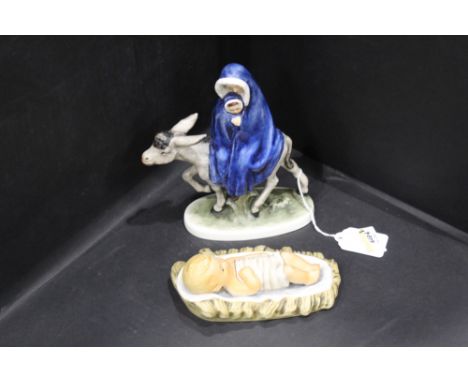 Two Hummel figurines, Jesus and Mary riding a donkey 