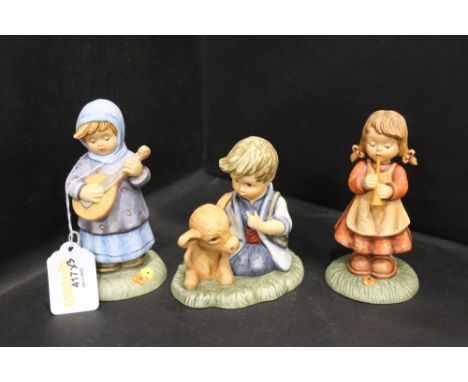 Three Hummel Nativity figures, boy with calf, girl with lute, girl with recorder