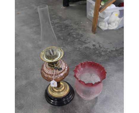 Oil lamp with cranberry glass shade and reservoir 